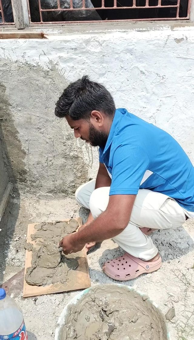 Candidates undergoing hands-on masonry and carpentry trade tests